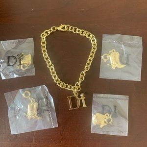 Diamonds International gold charm bracelet